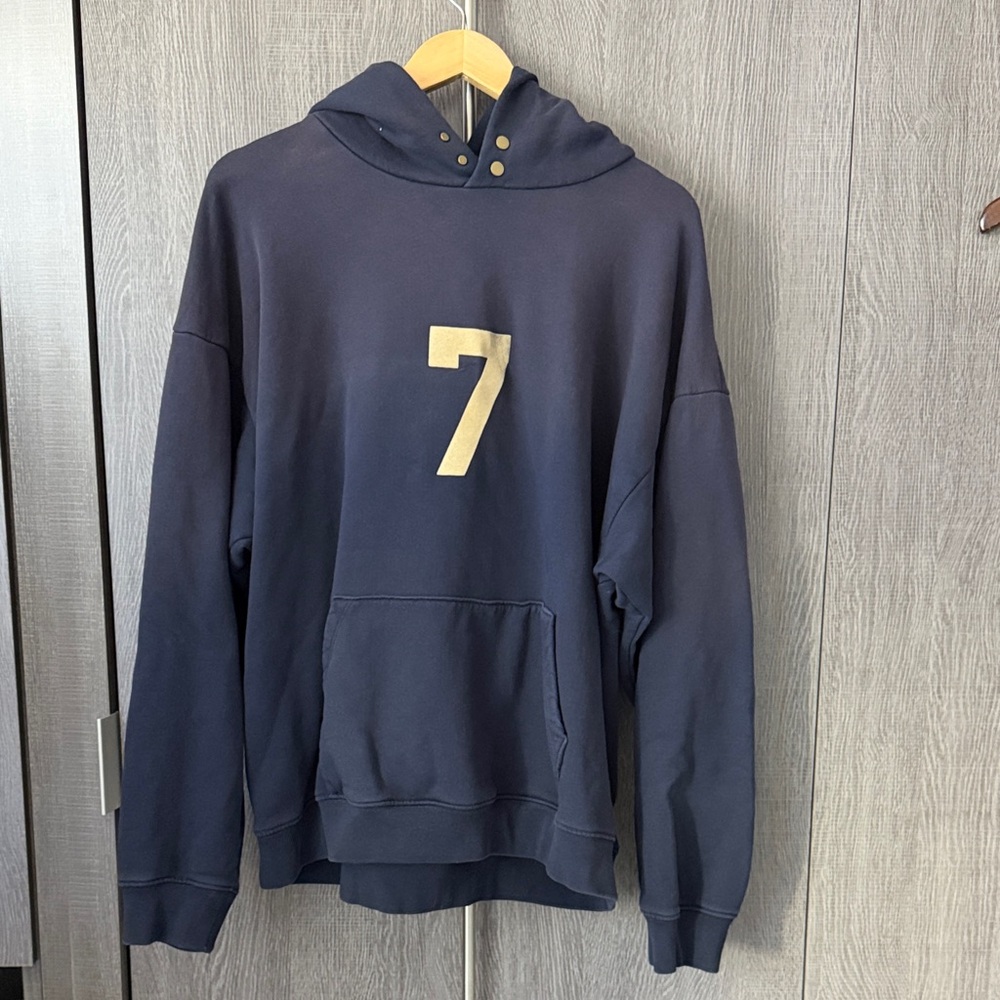 Fear of God Navy Hoodie with Gold Seven